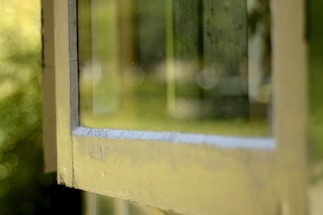 A close-up of sleek uPVC window frames reflecting sunlight, symbolizing precision and quality craftsmanship.