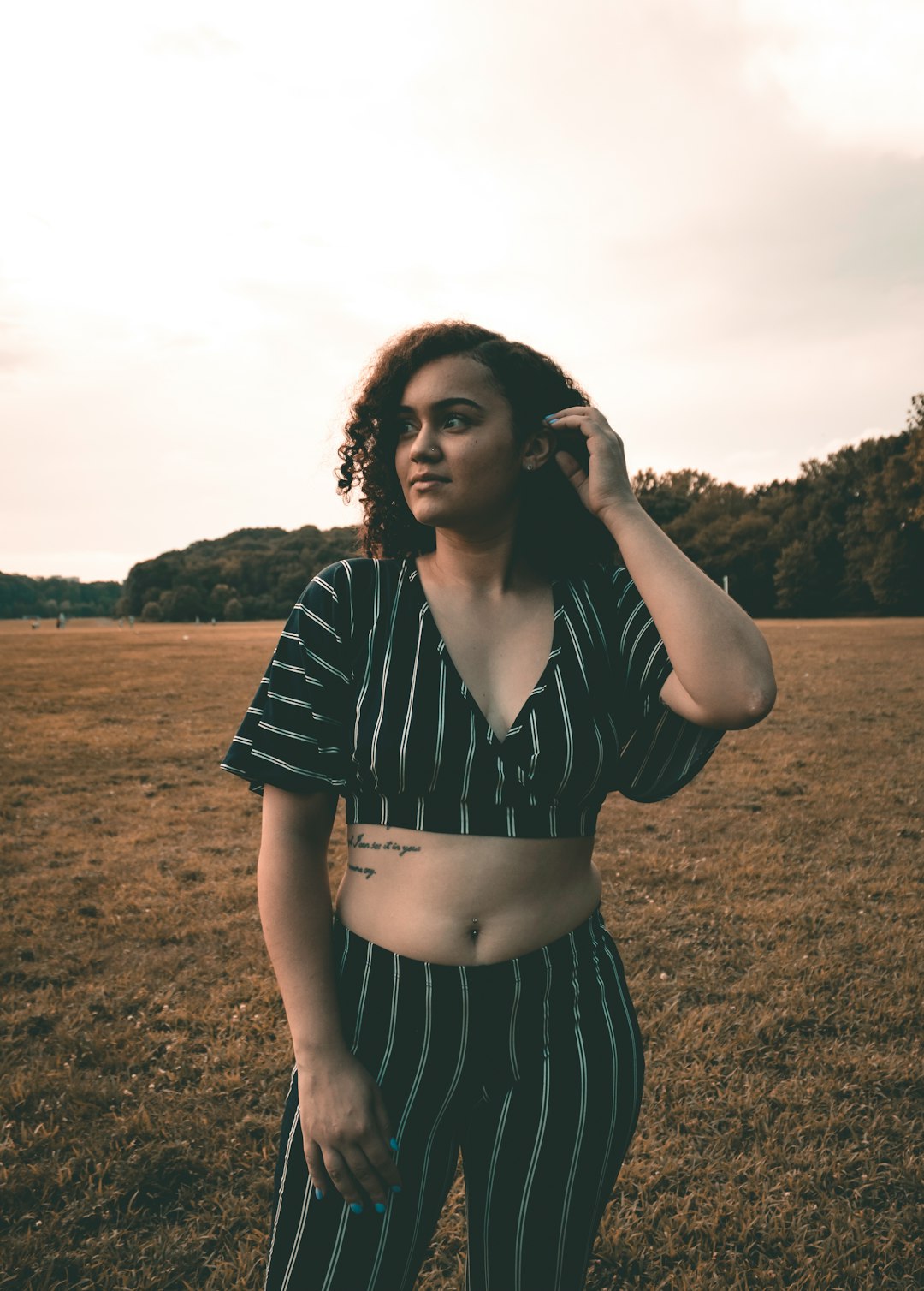 woman standing on grass field at daytime