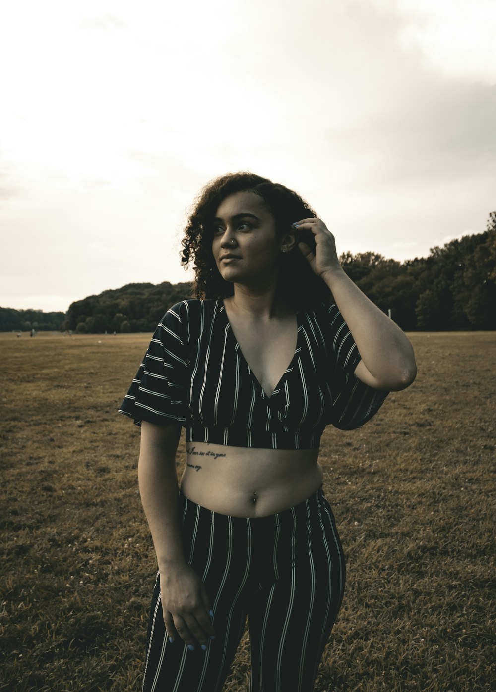 woman standing on grass field at daytime