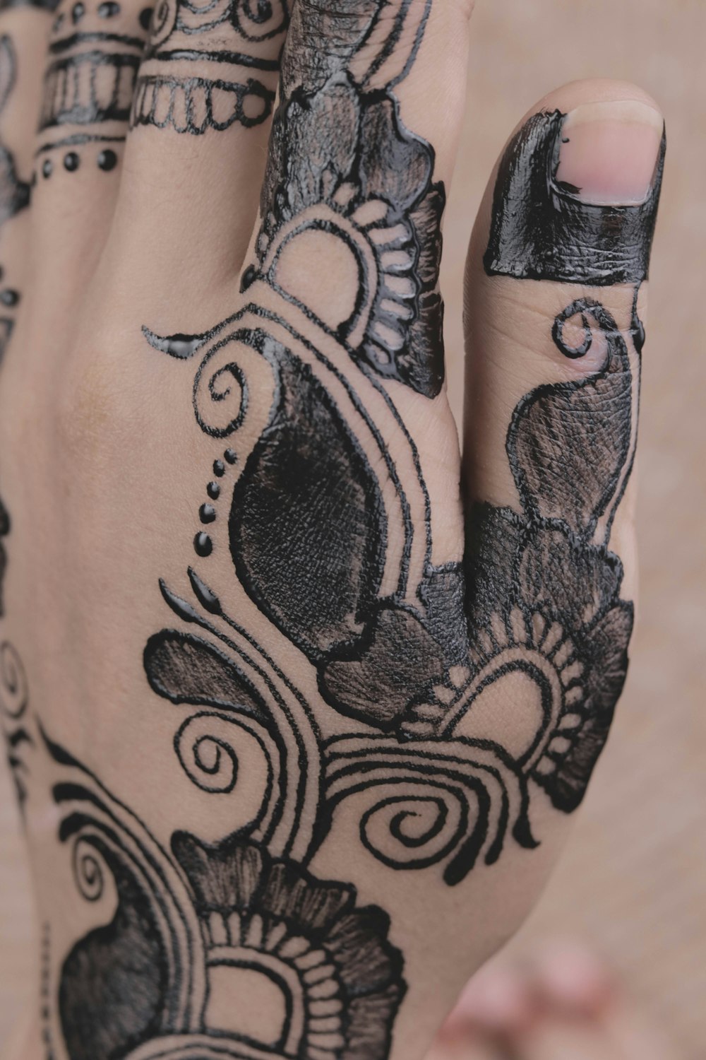 a woman's hand with a tattoo on it