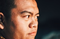 Close-up of a portrait enhanced with ultra-realistic skin retouching and lighting effects.