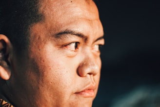 Close-up of a portrait enhanced with ultra-realistic skin retouching and lighting effects.