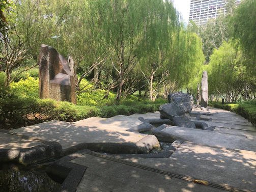 A serene AI-designed garden path winding through abstract foliage.