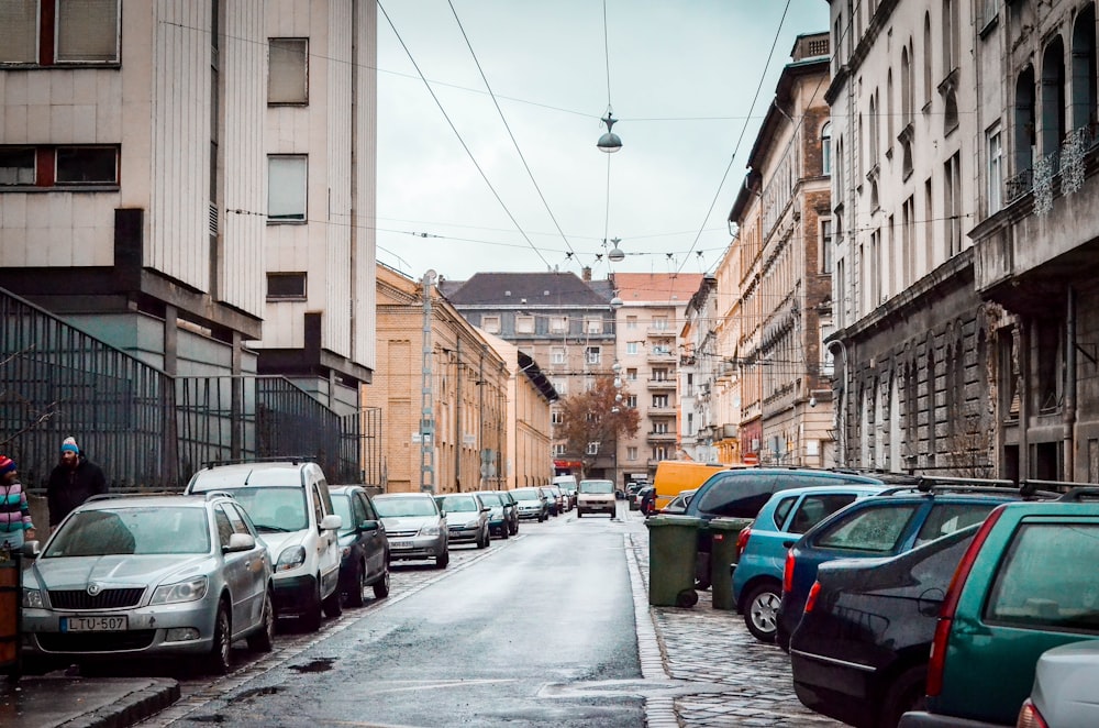 different vehicle parking near road during daytime