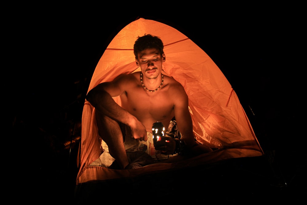 man inside dome tent