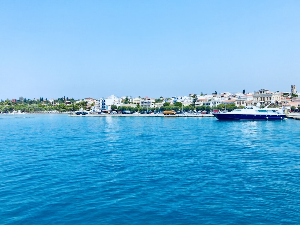 white and blue cruise ship