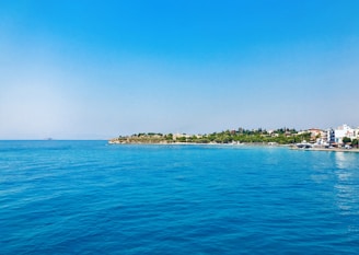 blue body of water under blue sky