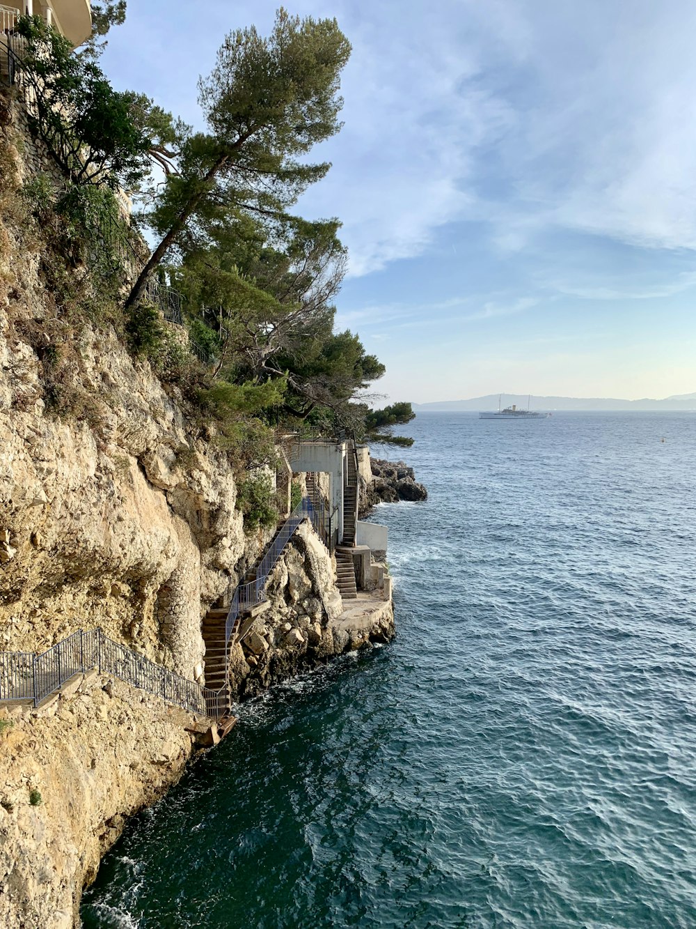 white concrete structure on cliff