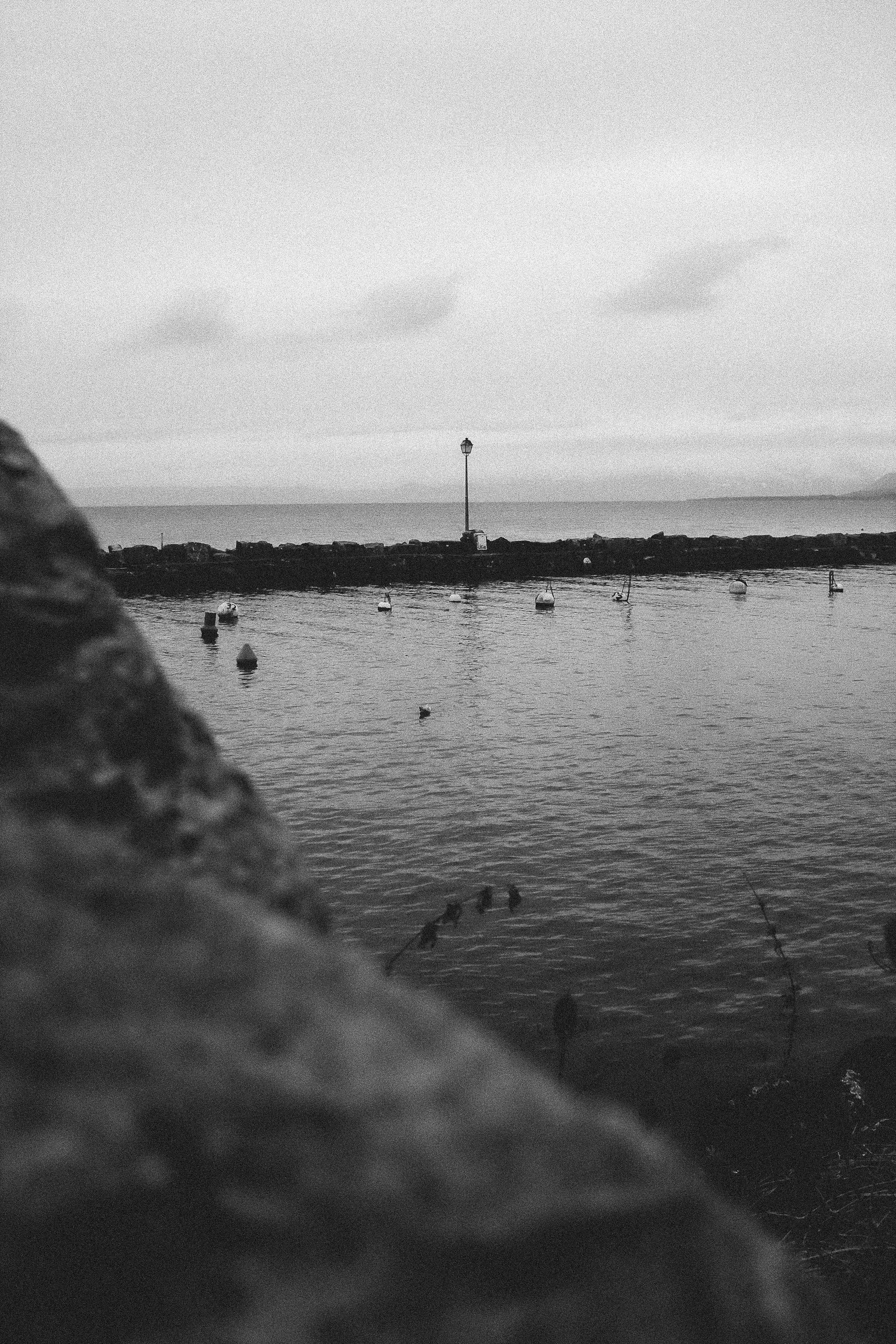 boats beside sea wall