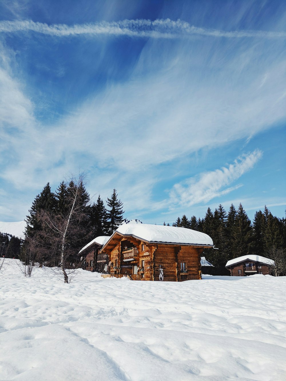 brown cabin on ice-covered land