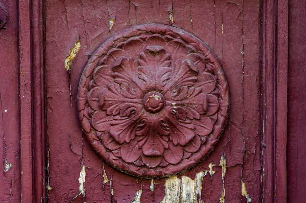 a close up of a door with peeling paint