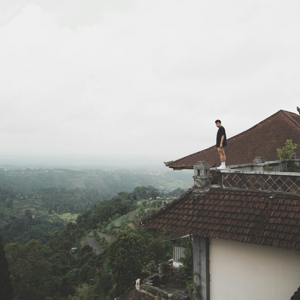 man standing on roof