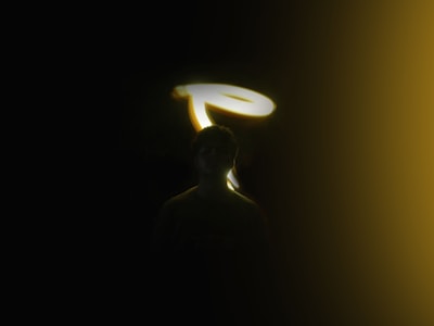 Flat LED angel figure glowing softly against a dark background.