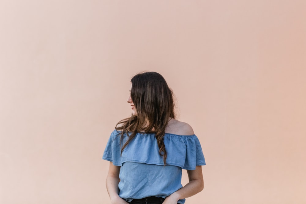 woman wearing blue off-shoulder blouse