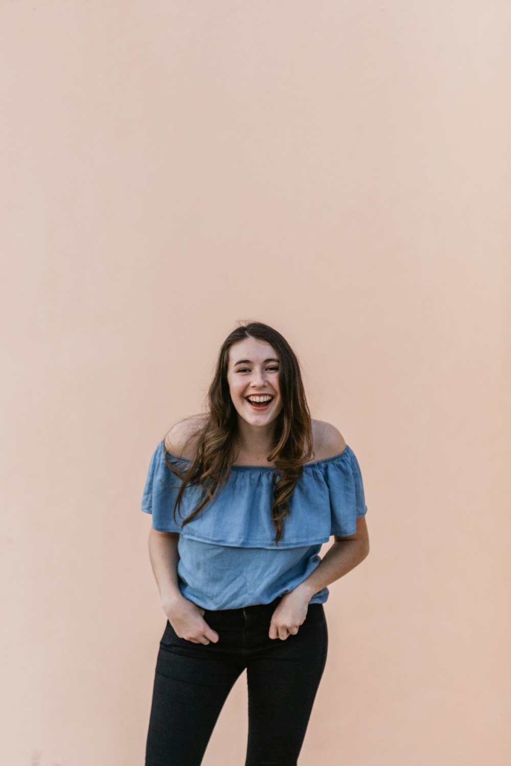 woman wearing blue off-shoulder shirt