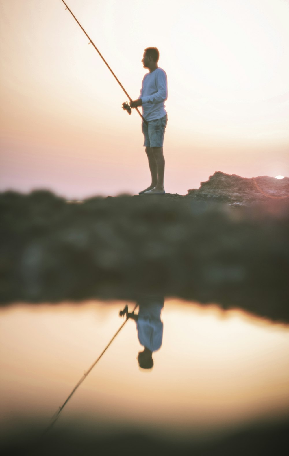 man holding fishing rod