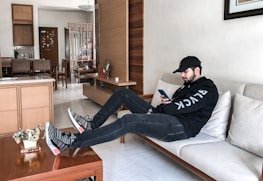 Lifestyle photo of a young person enjoying high-tech gadgets in a stylish, modern room.