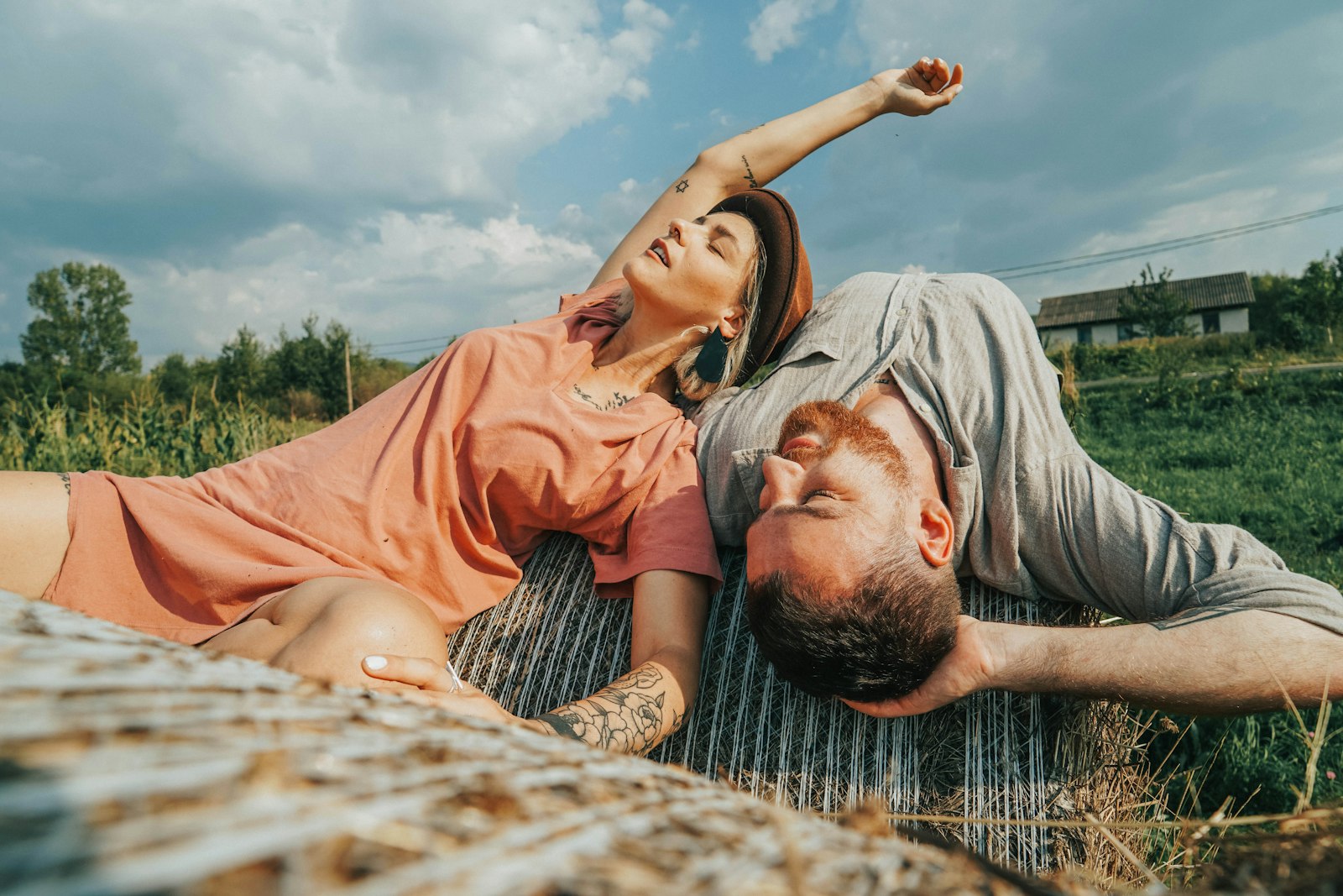 Samyang AF 14mm F2.8 FE sample photo. Couple lying on grass photography