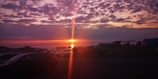 A stunning sunset view with a camper in the foreground.