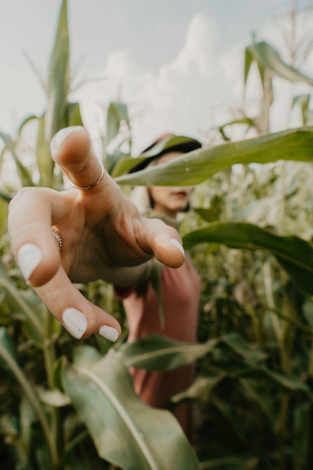 shallow focus photo of person showing right hand