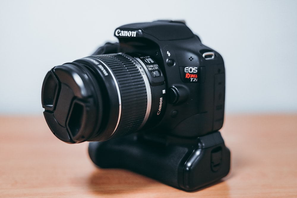 black Canon EOS Rebel DSLR camera