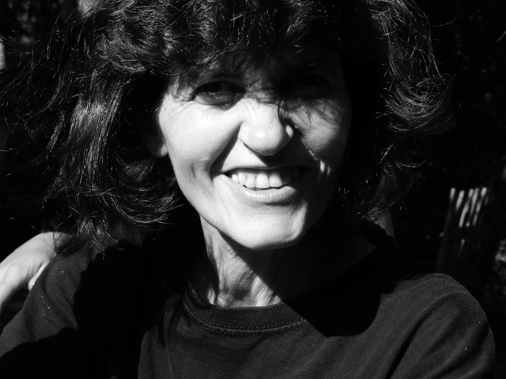 smiling woman wearing black shirt