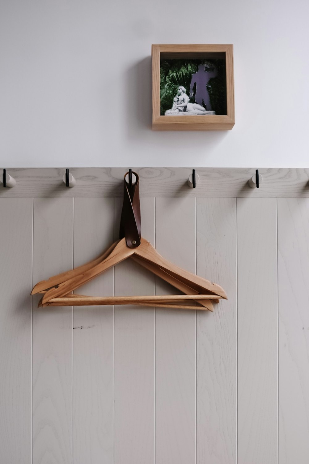hanged brown wooden clothes hangers