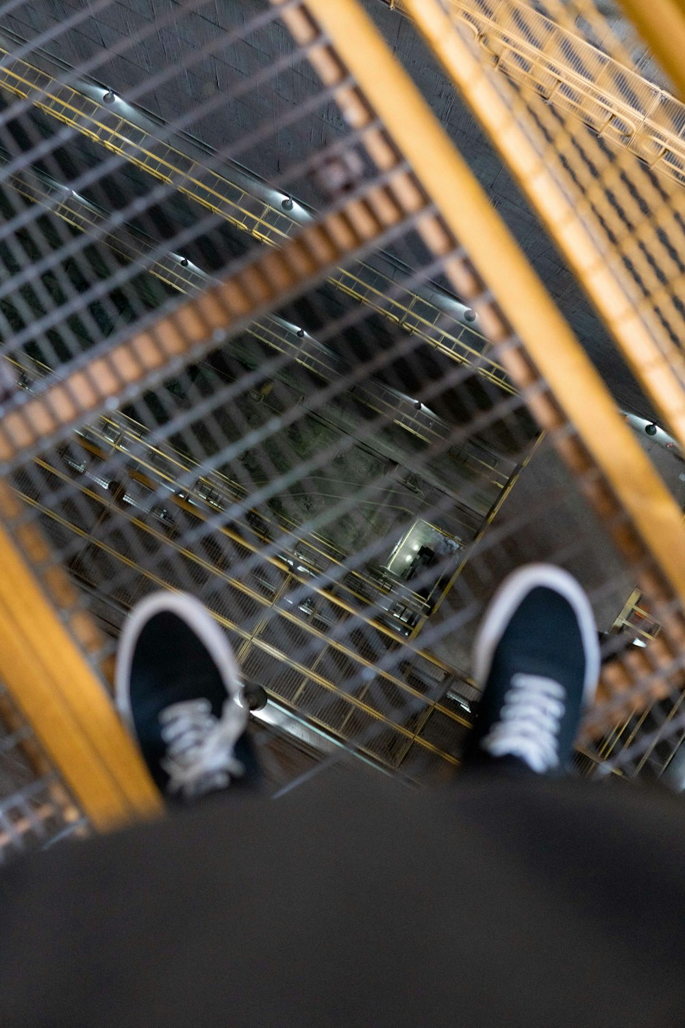 person wearing black-and-white sneakers