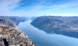 aerial-photography of water near mountains