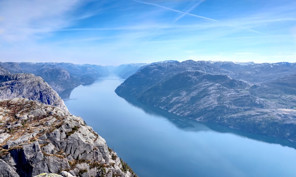 aerial-photography of water near mountains