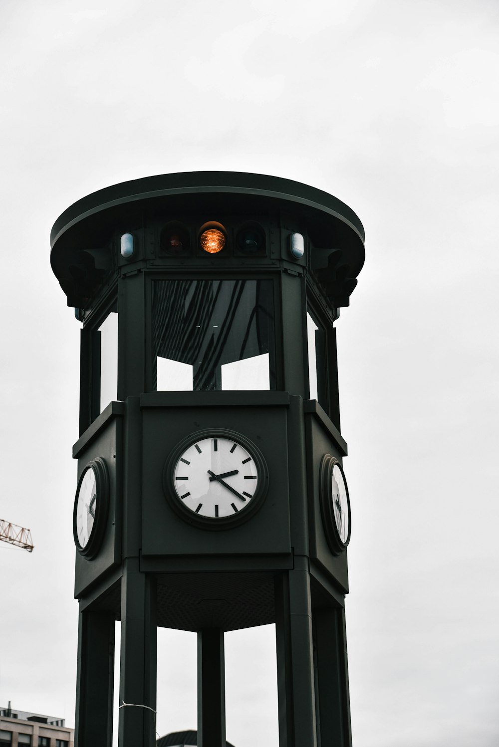 black and gray clock under clear blue sky