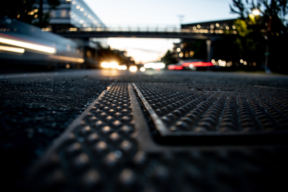 a close up of a metal grate on the ground