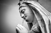 grayscale photo of Virgin Mary statue