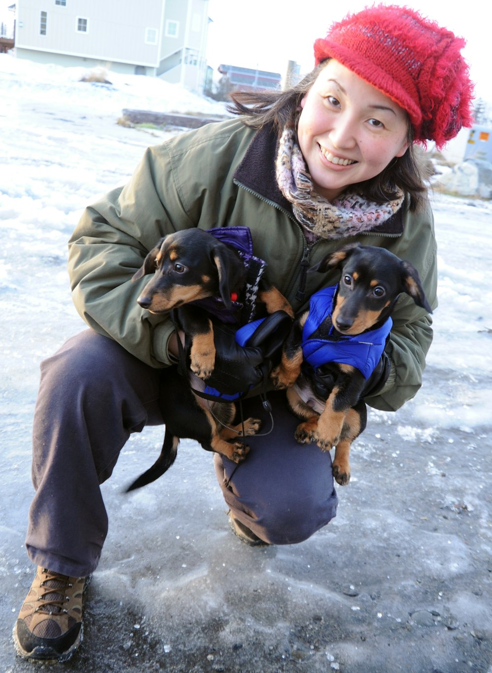 woman holding puppies
