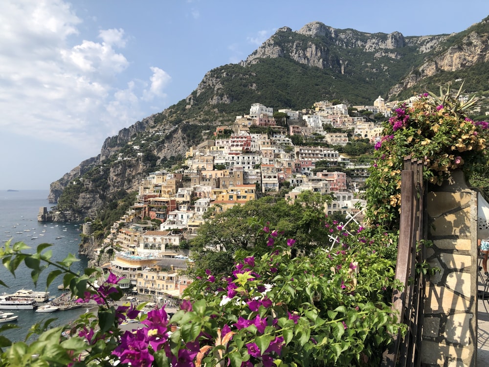 Positano in Italy under blue and white skies during daytime