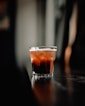 clear cup with beverage