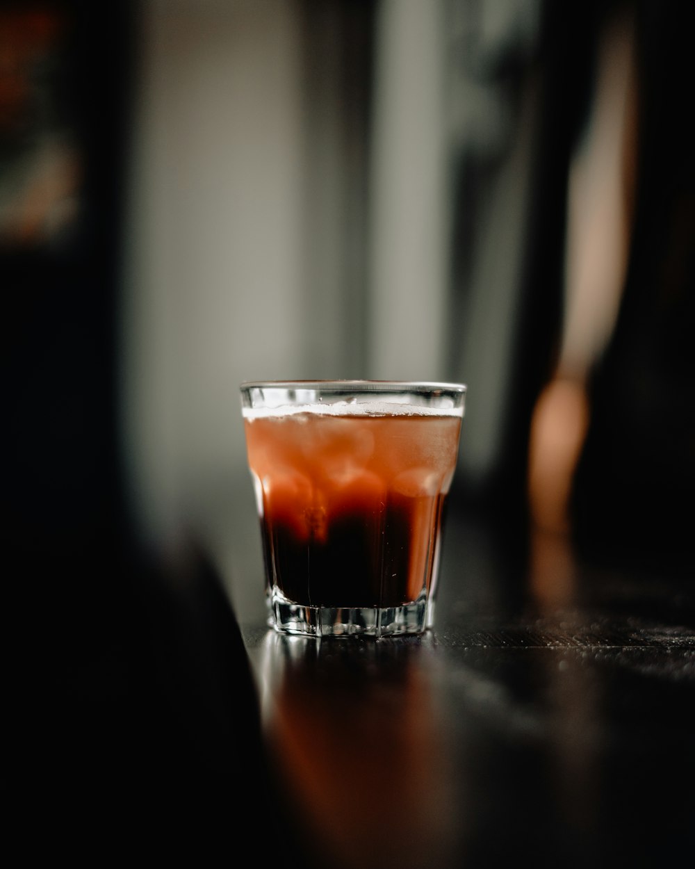 clear cup with beverage