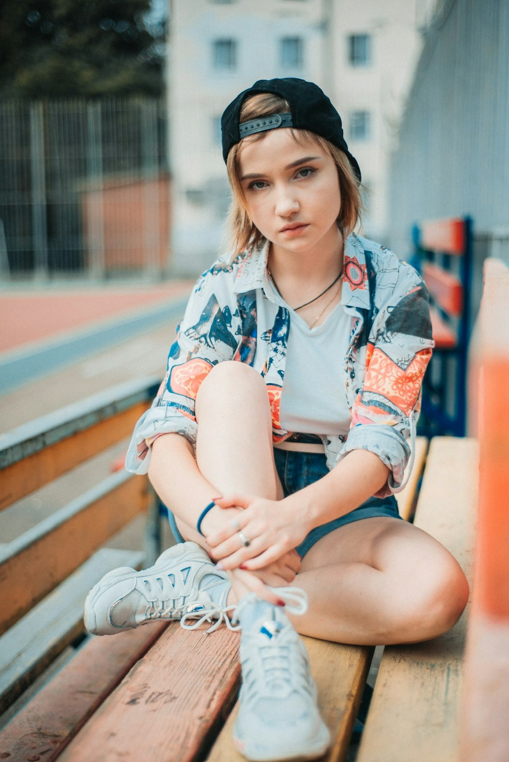 woman sitting on wooden bench