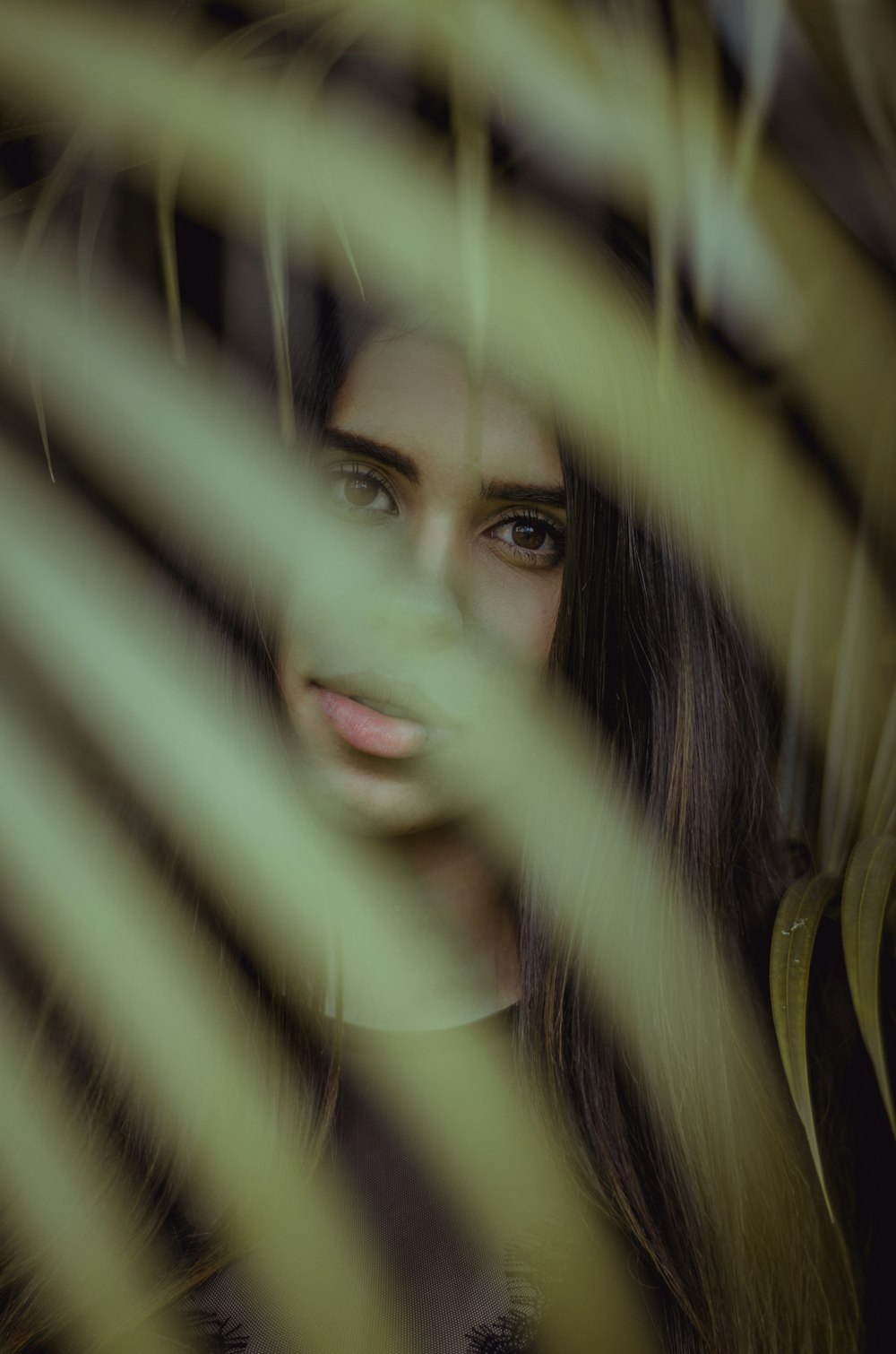 shallow focus photo of woman in black top