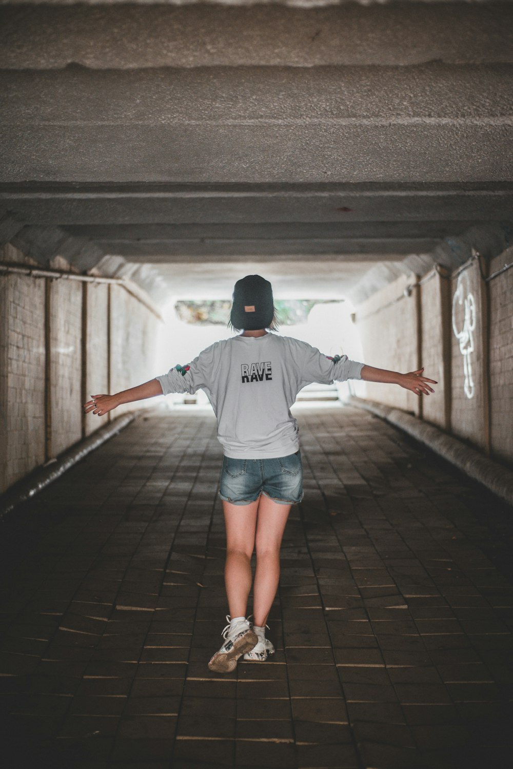 woman standing under tunner