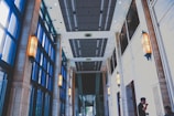 Brightly lit hallway showcasing contemporary ceiling designs.