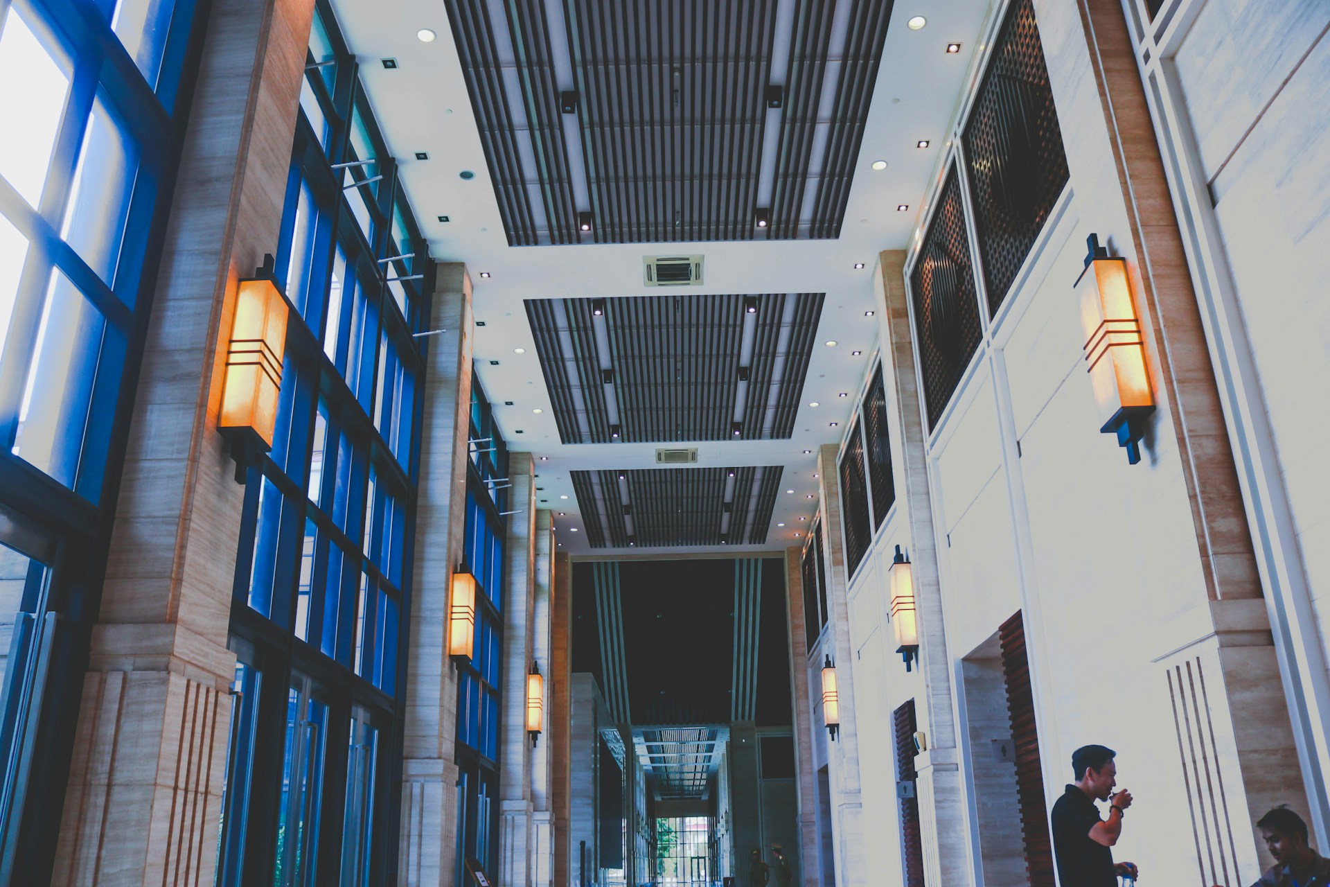 woman wearing yellow long-sleeved dress under white clouds and blue sky during daytime