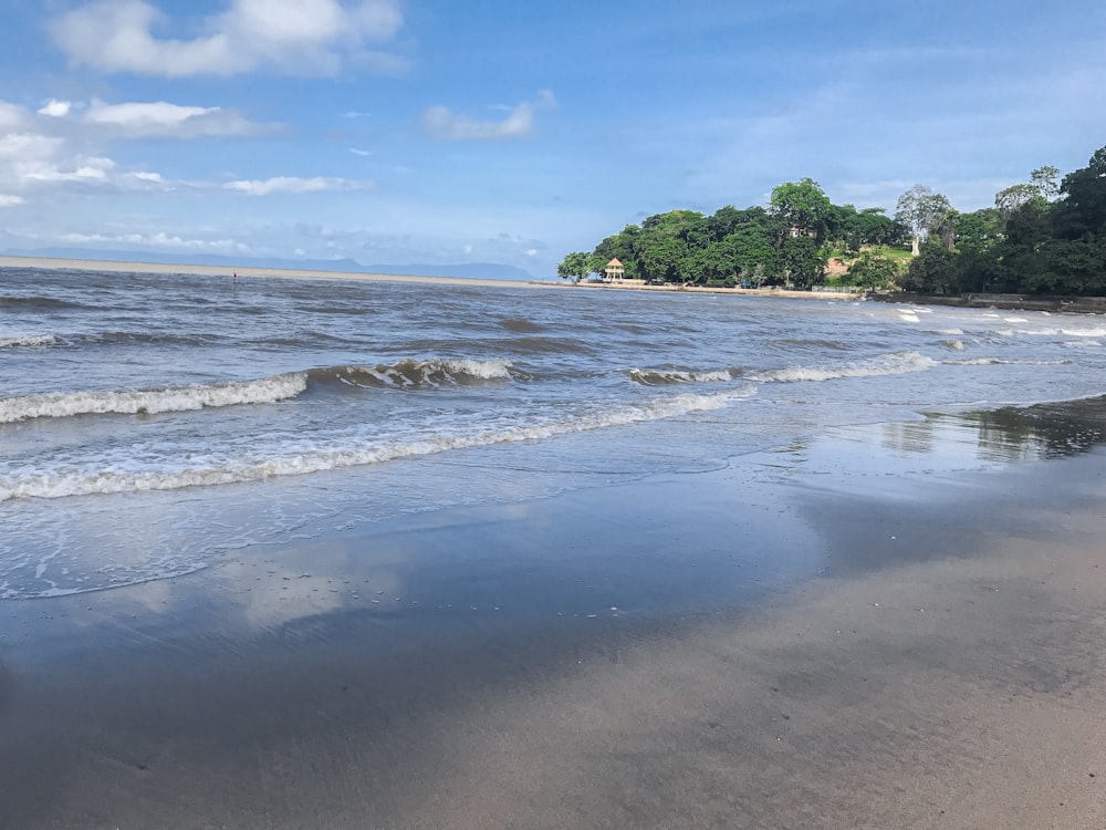 body of water under clear blue sky during daytime