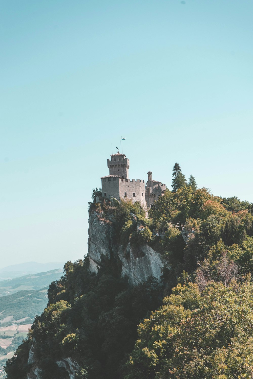 gray concrete castle on cliff during daytime