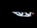 Brightly illuminated LED headlights with a modern, sleek design visible in the darkness, emphasizing a futuristic and high-tech aesthetic.