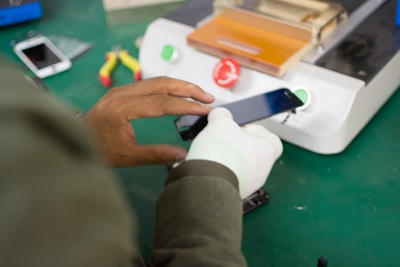 person holding smartphone screen