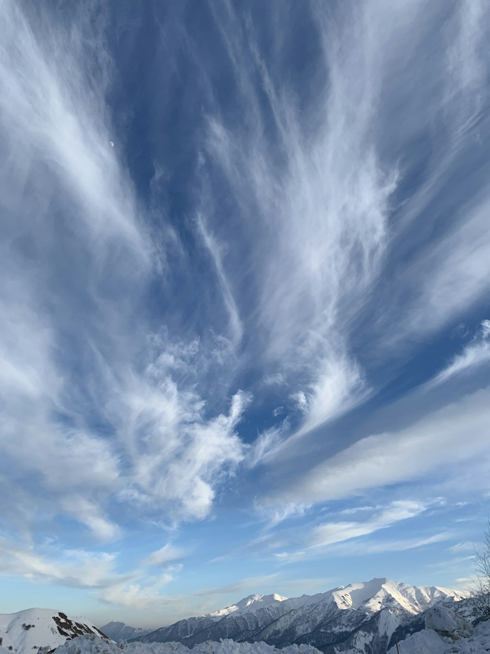 snow-capped mountain under cloudy sky during daytime