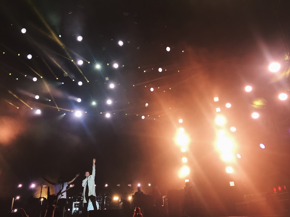 man singing on stage