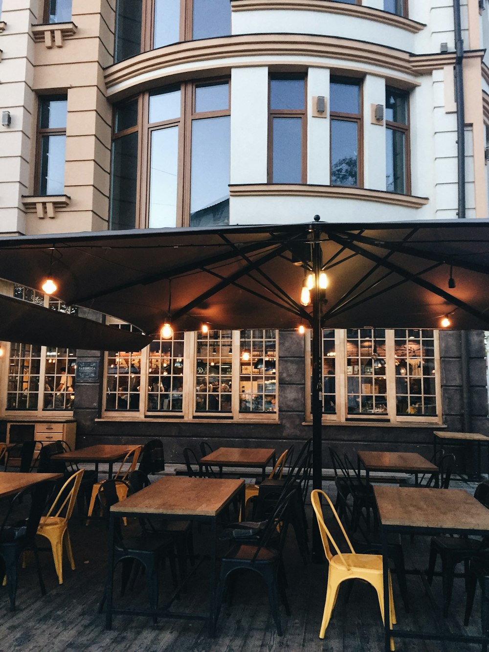 empty tables under parasol