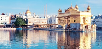 A serene temple courtyard bathed in golden sunlight during a morning prayer.